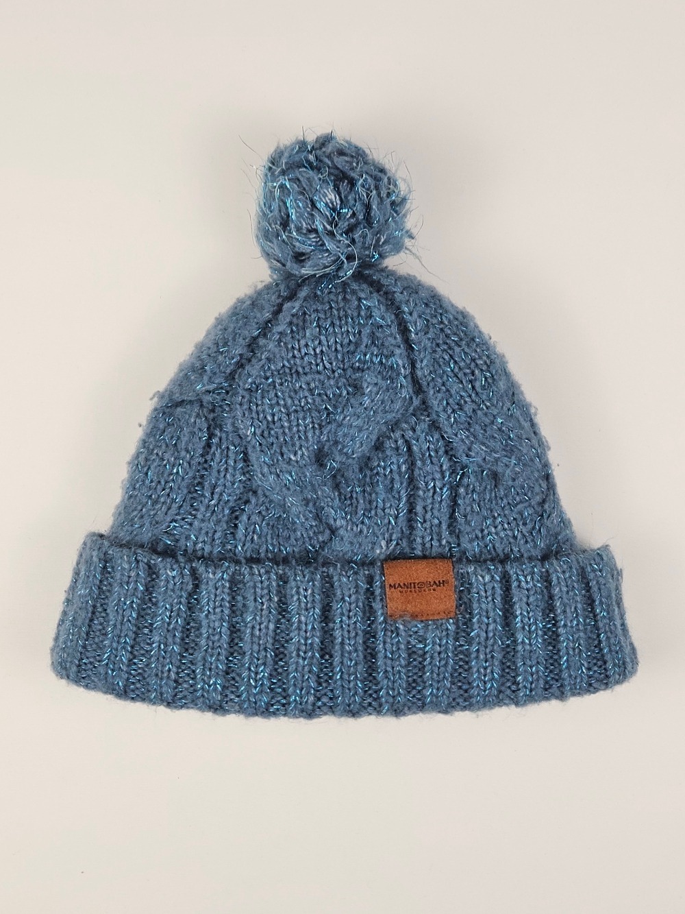 Manitobah Mukluks⁠ Blue Cable Knit Pom Pom Beanie Sherpa
